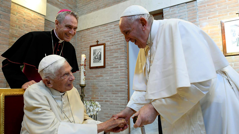 Pope Francis greets Pope Emeritus Benedict XVI, 2022