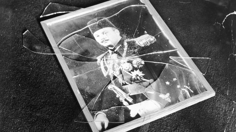 Picture of Farouk I with broken glass