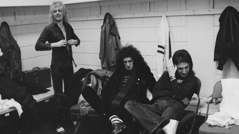 Members of Queen in their dressing room in 1977, black and white