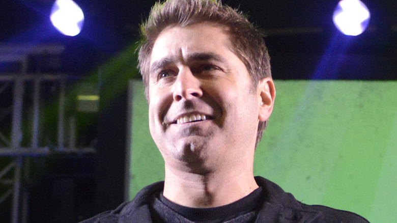 toy belleci smiling into distance