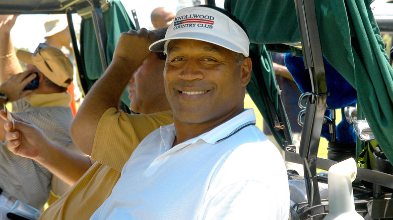 O.J. Simpson smiling at golf event