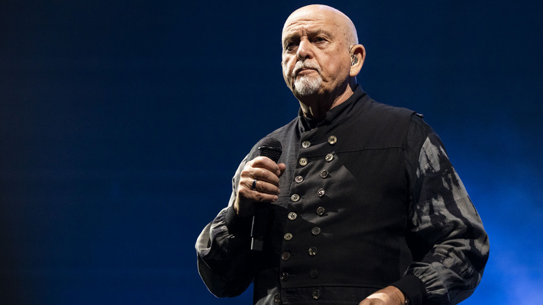Peter Gabriel performing on stage