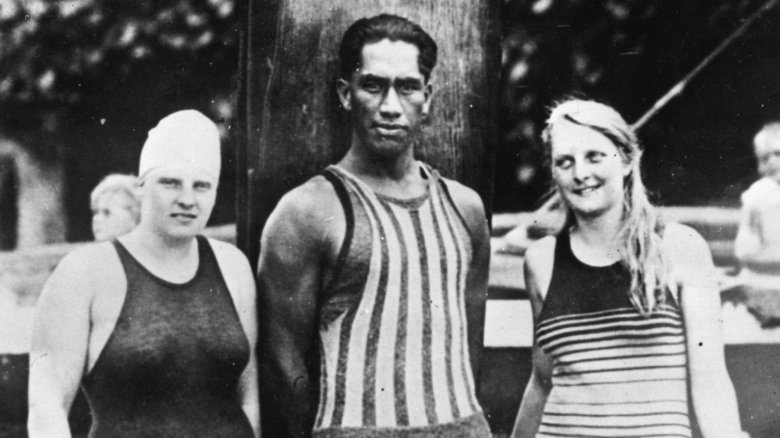 Duke Kahanamoku with two other swimmers