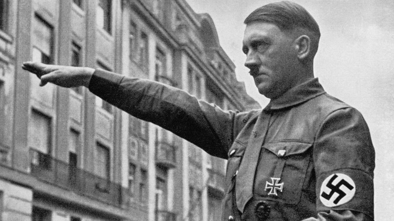 Hitler gives Nazi salute