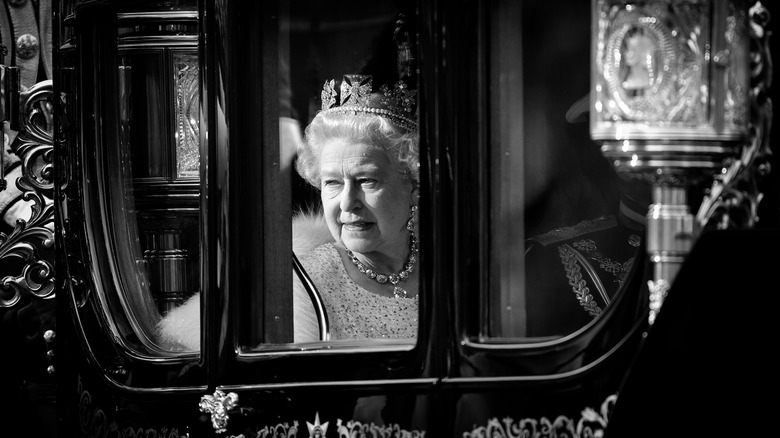Elizabeth II looks through carriage