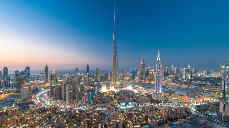 Burj Khalifa towering over other buildings in Dubai