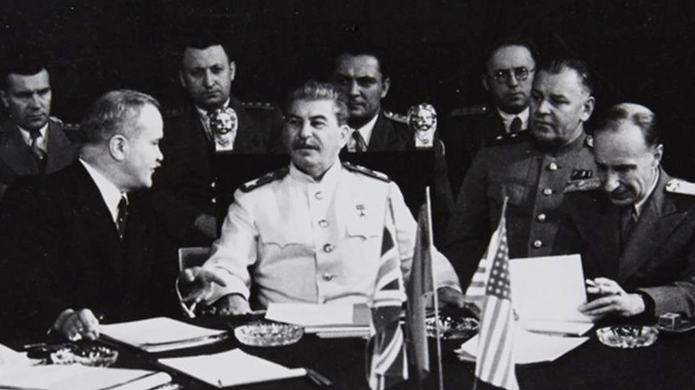 Men surround Joseph Stalin