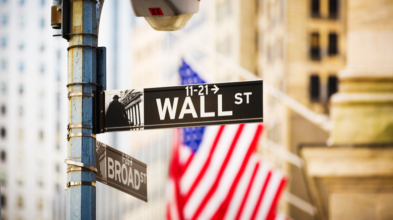 Sign for Wall Street with American flag