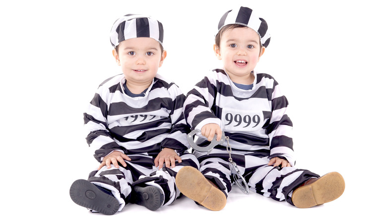 Twins in prison costumes