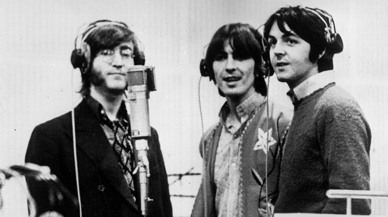 Lennon, Harrison and McCartney singing behind mic