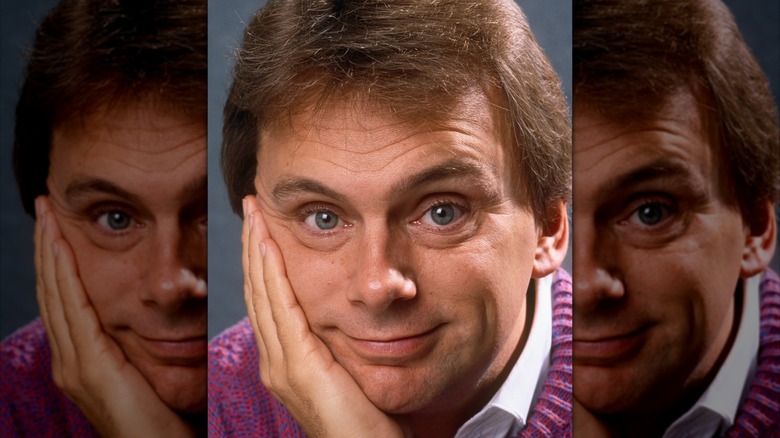 Pat Sajak leans on his hand