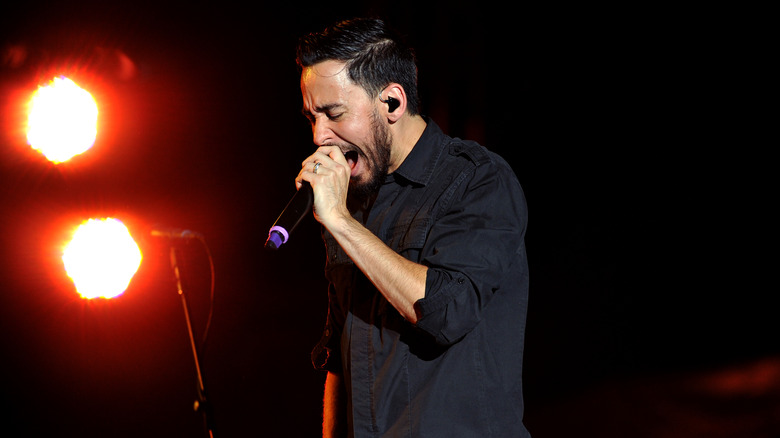 Mike Shinoda raps on stage