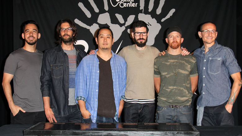 Linkin Park bandmates pose at guitar center