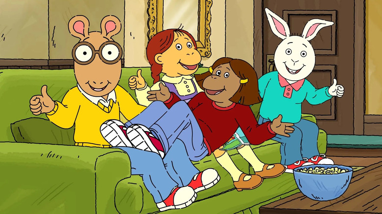 Arthur cast sitting on a couch