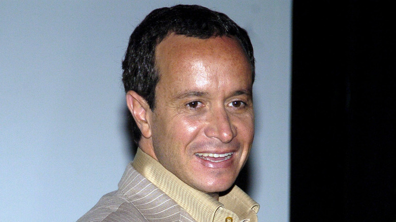 Pauly Shore smiling in pinstriped suit 