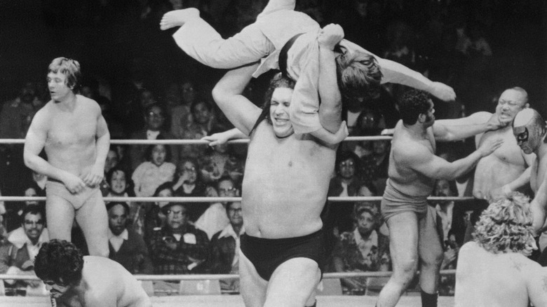 Andre the Giant picking up person