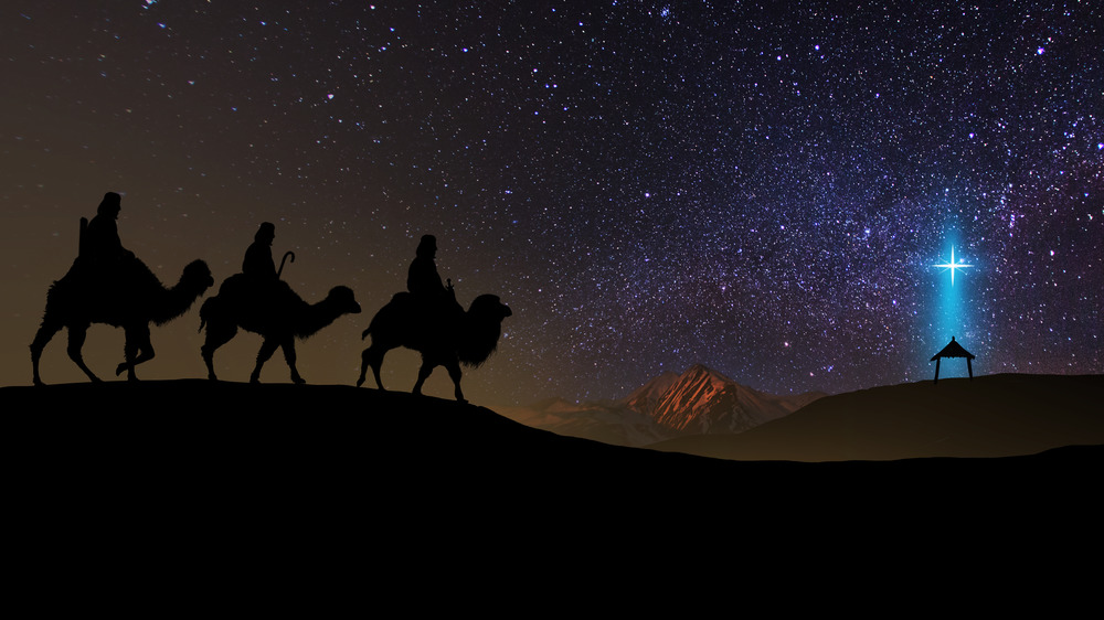 Three wise men travelling on camels