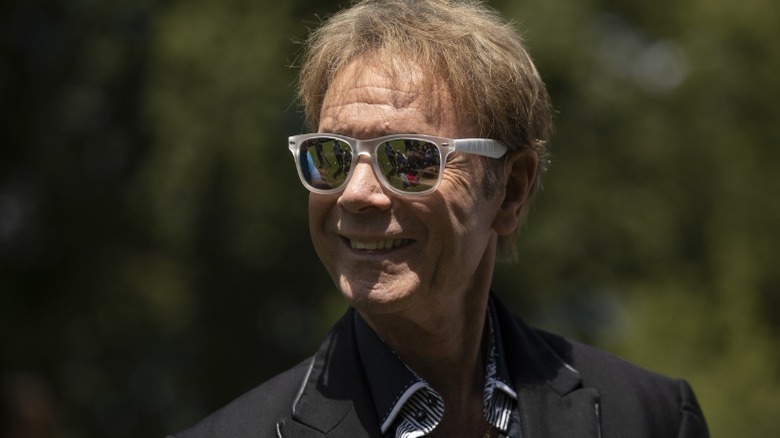 Cliff Richard wearing sunglasses