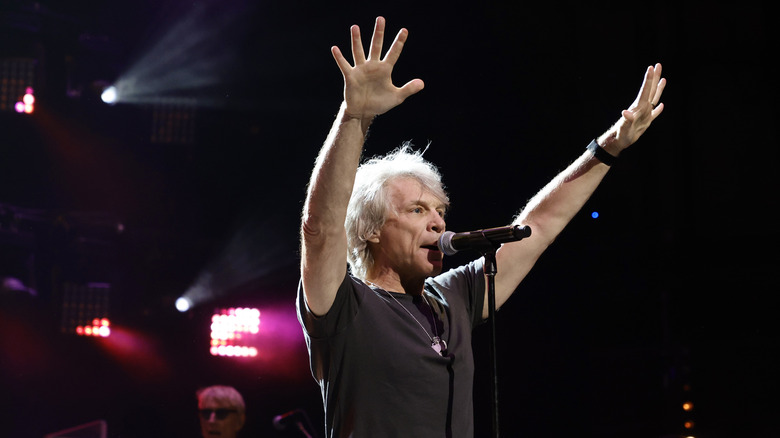 Jon Bon Jovi raising hands