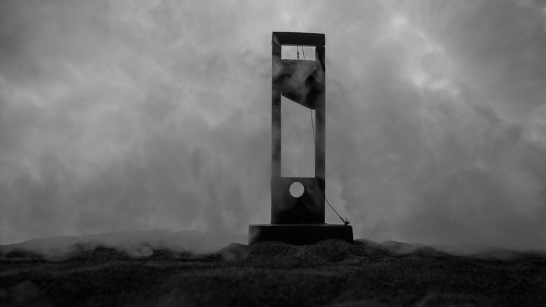 Hilltop guillotine in fog