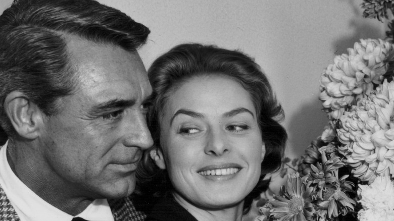 Ingrid Bergman cuddles Cary Grant