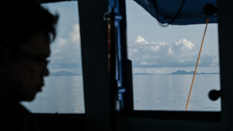 Fisherman's silhouette on fishing boat