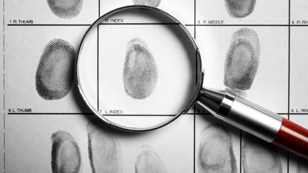 crime fingerprints magnifying glass