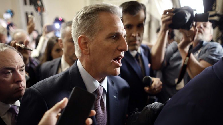 Kevin McCarthy surrounded by journalists