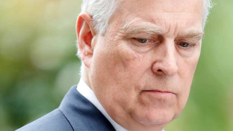 Prince Andrew frowning with grey hair