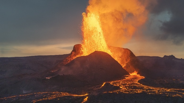 Volcano erupting magma into air