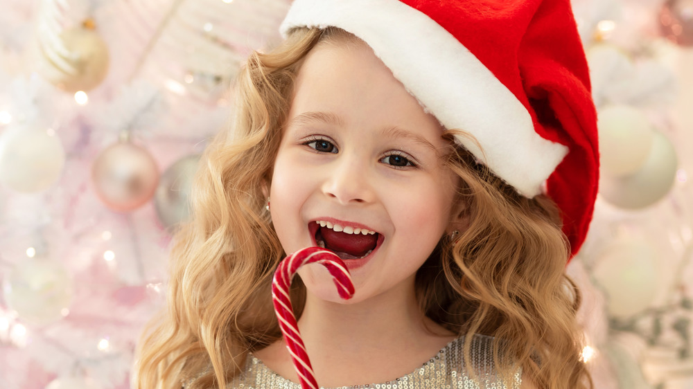 Child with candy cane
