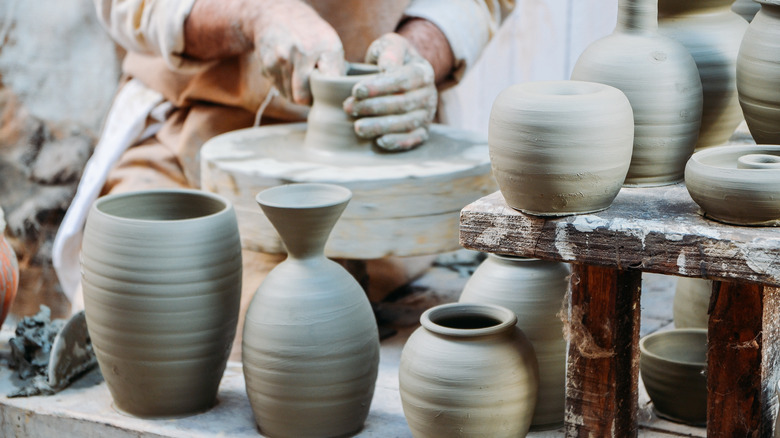 potter making drinking and eating vessels