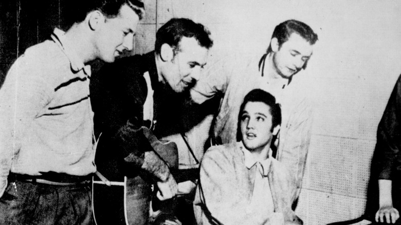 Elvis Presley, Johnny Cash, Jerry Lee Lewis, and Carl Perkins performing
