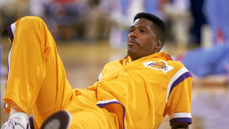 Jay Vincent sitting on a basketball court