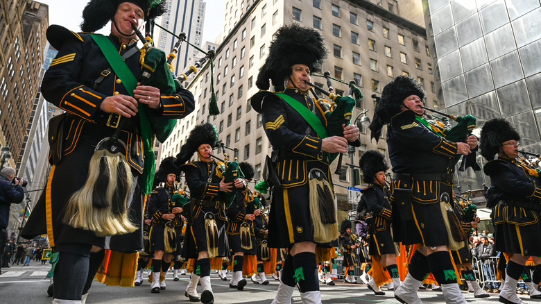 Pipers parade down street